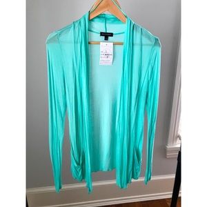 Teal cardigan with small nick on the left sleeve